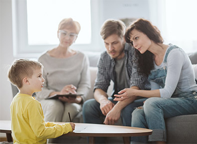 parents with young child and counselor