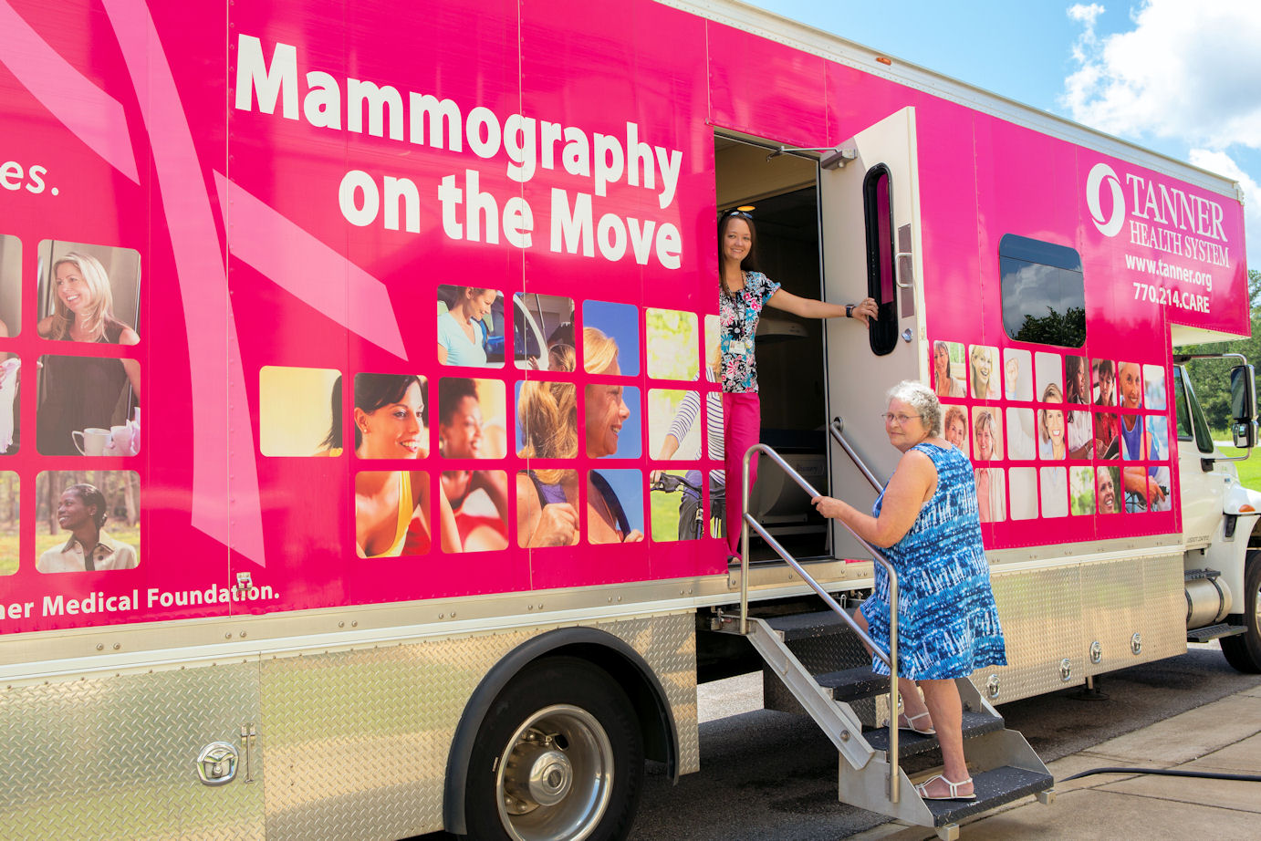 Elsie Wilson climbing about the mobile mammography unit