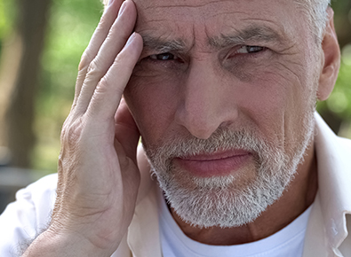 Bearded man with headache