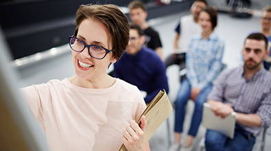 Woman in glasses teaching class