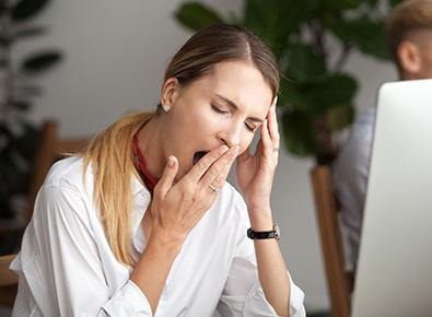 Woman yawning