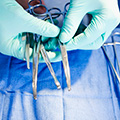 Surgeon placing instruments