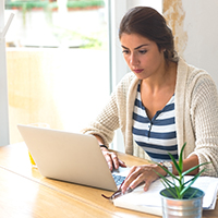 woman looking at computer