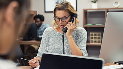 woman at work on phone