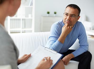 Man speaking with a therapist.