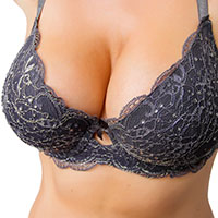 Breasts in black lace bra.