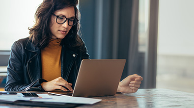 Woman browsing internet on laptop