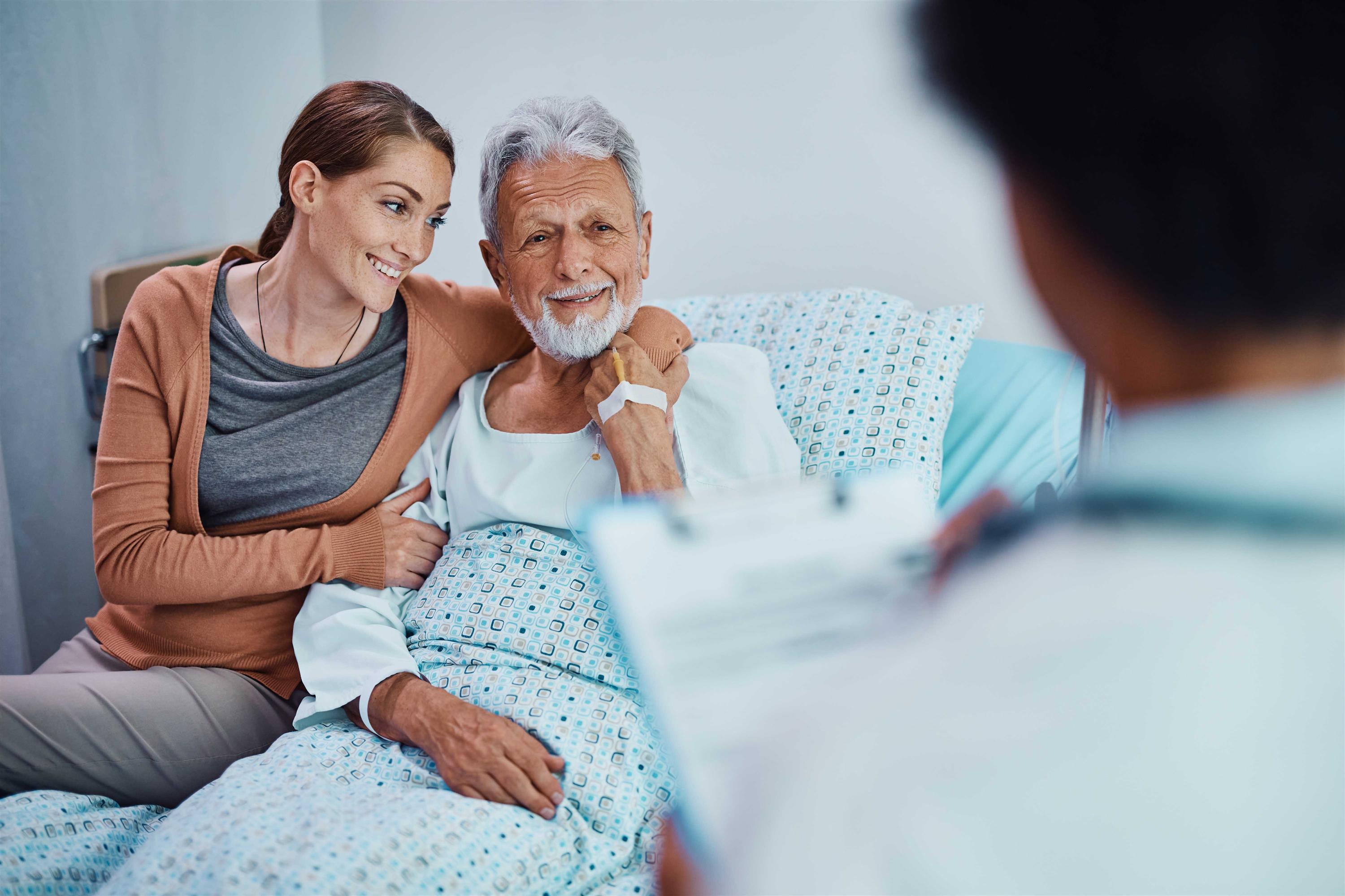 Father and daughter talking to doctor