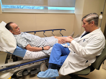Christopher Arant, MD, an interventional cardiologist with Tanner Heart & Vascular Specialists, covers the risks before John Crosby’s interventional procedure during a dry run of Tanner’s open-heart program.