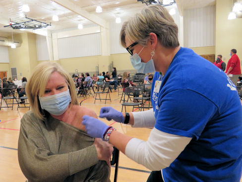 Karen Wild, director of school improvements for Carrollton City Schools, received her first dose of COVID-19 vaccine from Tanner nurse Sherri Staggs, RN. Tanner organized the vaccination event following Gov. Brian Kemp’s decision to expand COVID-19 vaccine availability to educators.