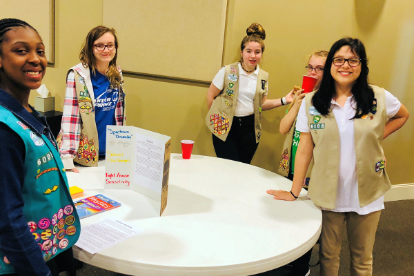 Girl Scouts around a table