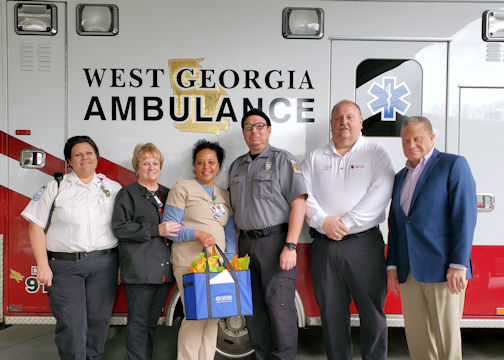 Nurses present a gift of appreciation to paramedic William Golden with West Georgia Ambulance