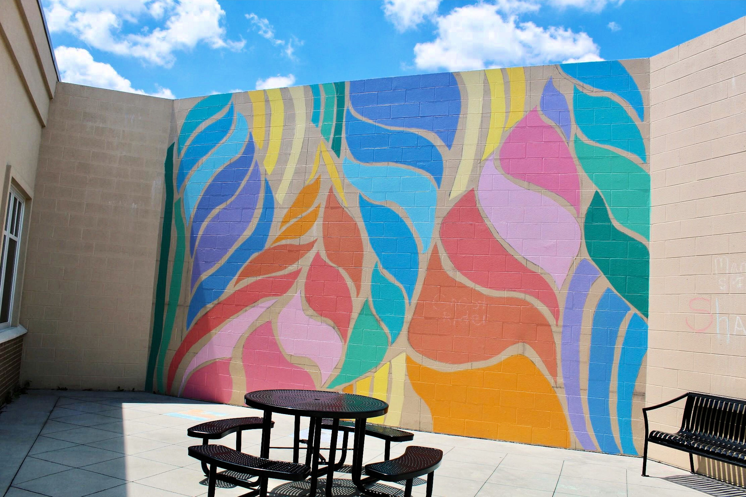 Mural in a courtyard at Willowbrooke at Tanner