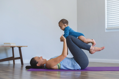 Mother with baby doing yoga