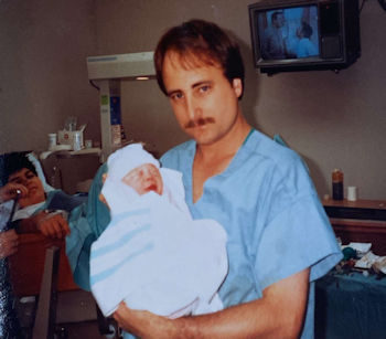 Dr. Helton holding baby Jennifer
