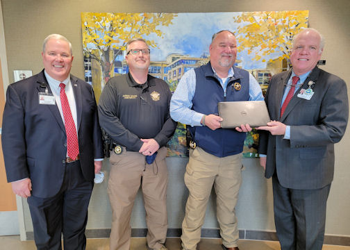 Tanner Health System has donated 10 retired laptops, valued at about $10,000, to the Haralson County Sheriff’s Office to be deployed in the deputies’ patrol cars. From left, Tanner Vice President of Campus and Support Services Gary Thomas, Haralson County Sheriff’s Office Chief Deputy Jamison Sailors, Sheriff Stacy Williams and Tanner President and CEO Loy Howard.