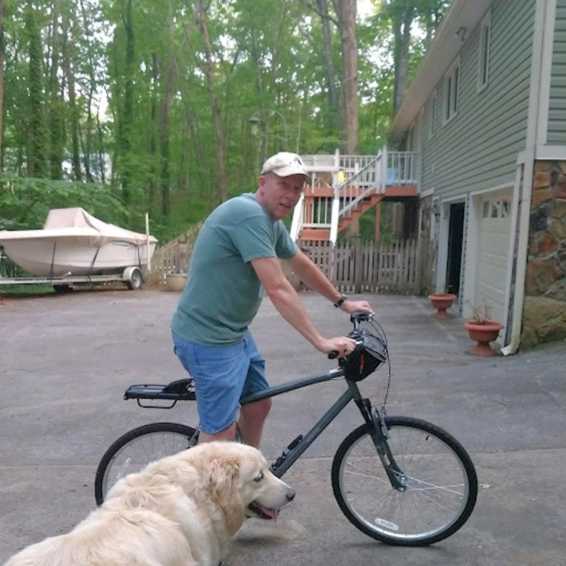 John Playford on bicycle