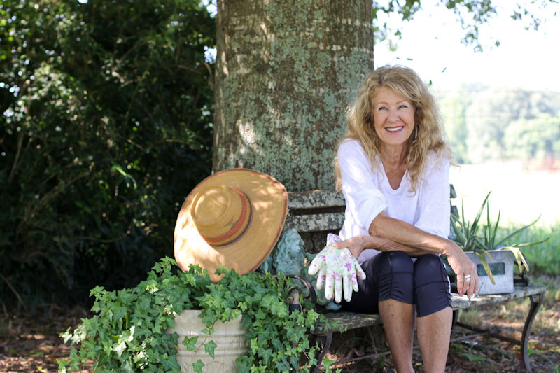 Judy Willis sitting in a garden