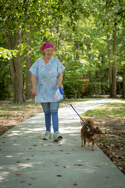 Linda Johnson walks dog, Hershey