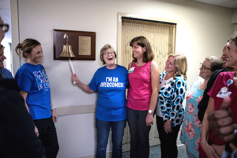 Diane Frey and wellwishers ring the bell at Tanner Cancer Care