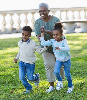 Grandmother outside with her grandkids