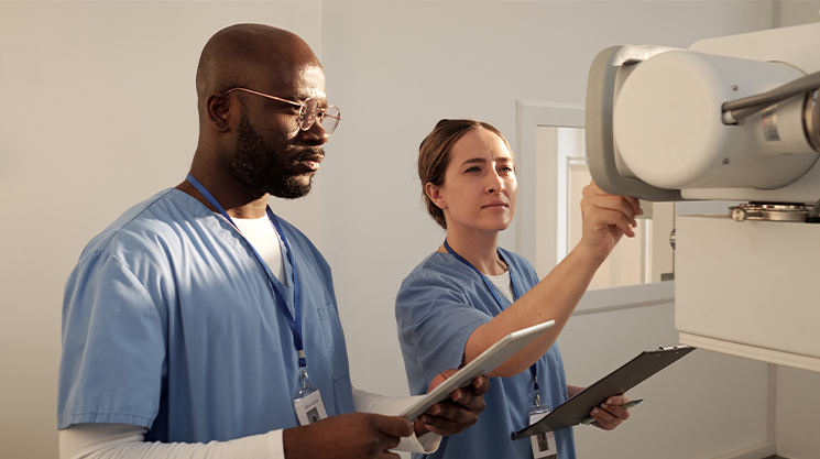 Doctor looking at xray machine