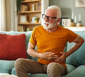 Man in pain holding his side