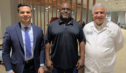 Stoney Ray Cheeks standing with Dr. Lattouf and Dr. Khawaja