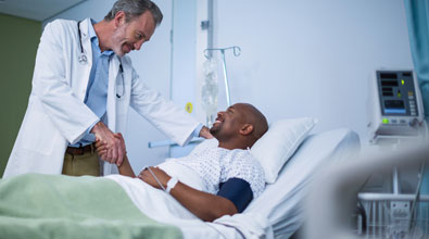 Doctor visiting a patient prepared for surgery.