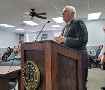 Tanner President and CEO Loy Howard speaking at podium